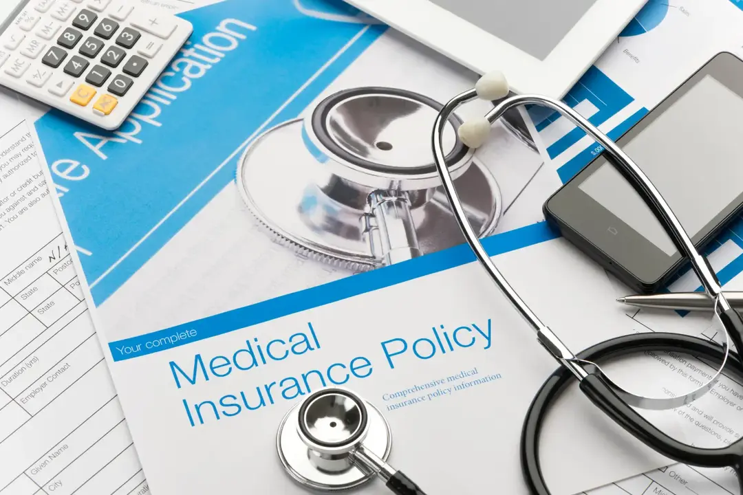 Medical Insurance Policy Documents, Calculator, Stethoscope, Cellphone, Tablet