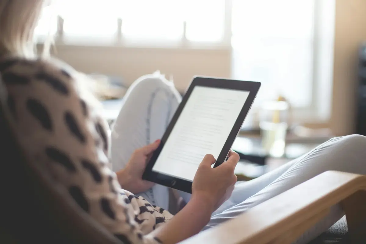 Person on ereader, reading
